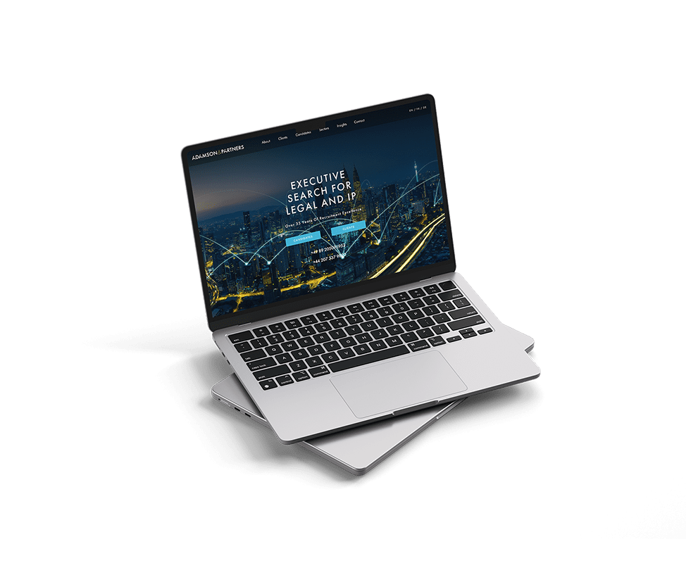 Adamsons and Partners website mockup on a laptop
