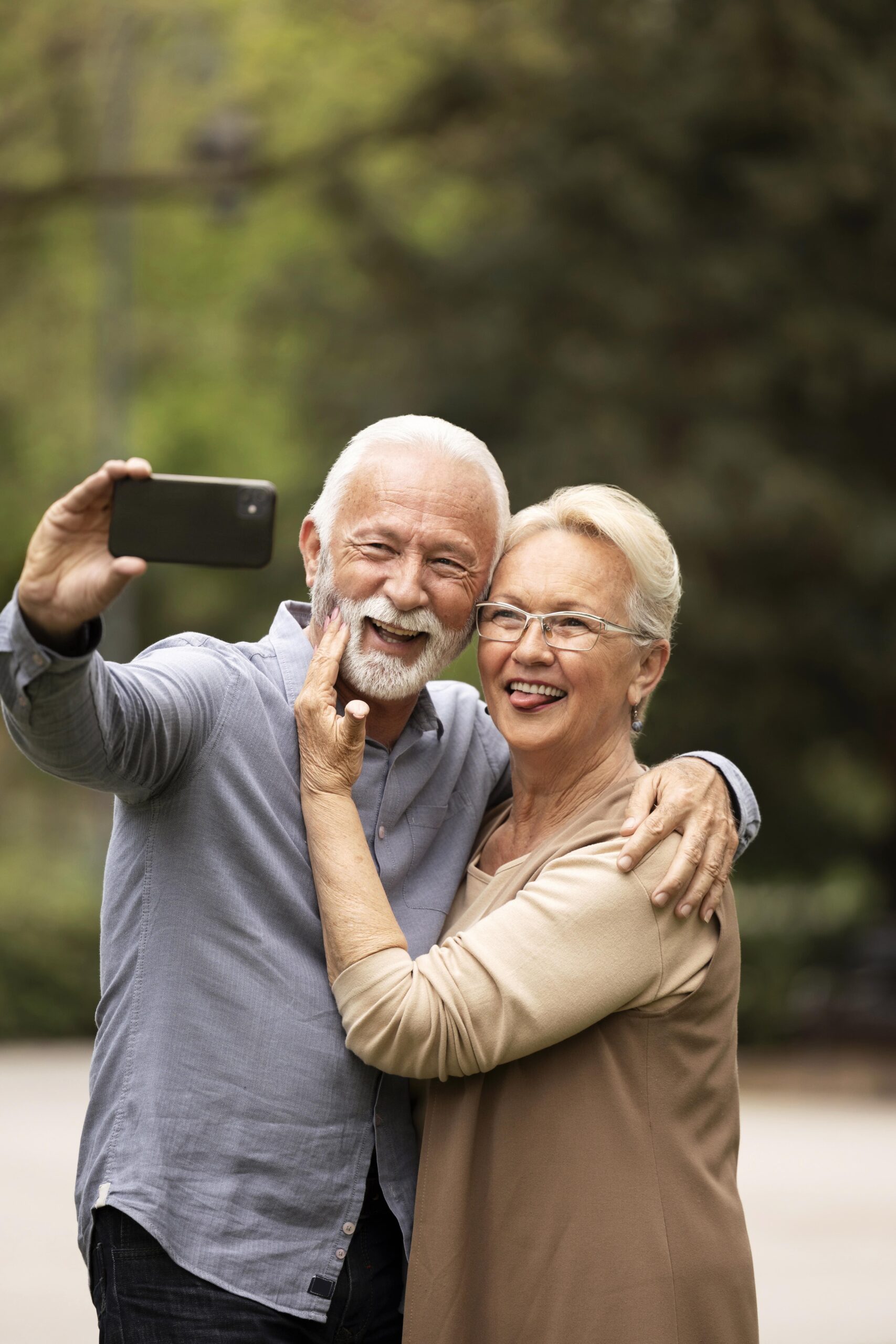 Old couple taking silly selfie