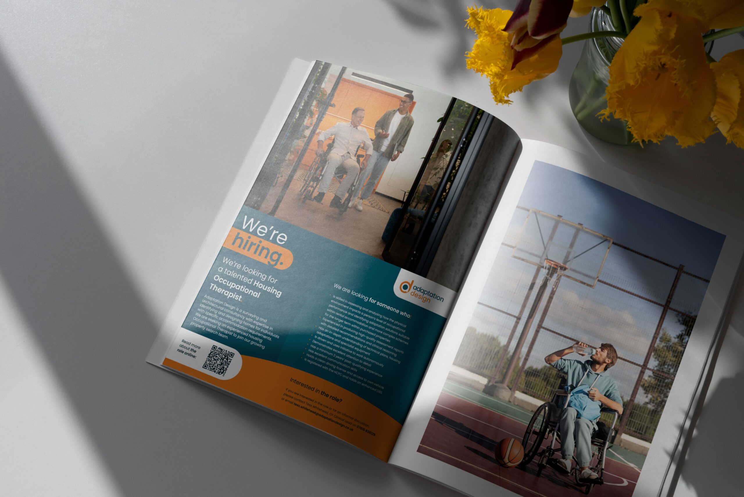 Adaptation Design half page magazine advert mocked up on a table