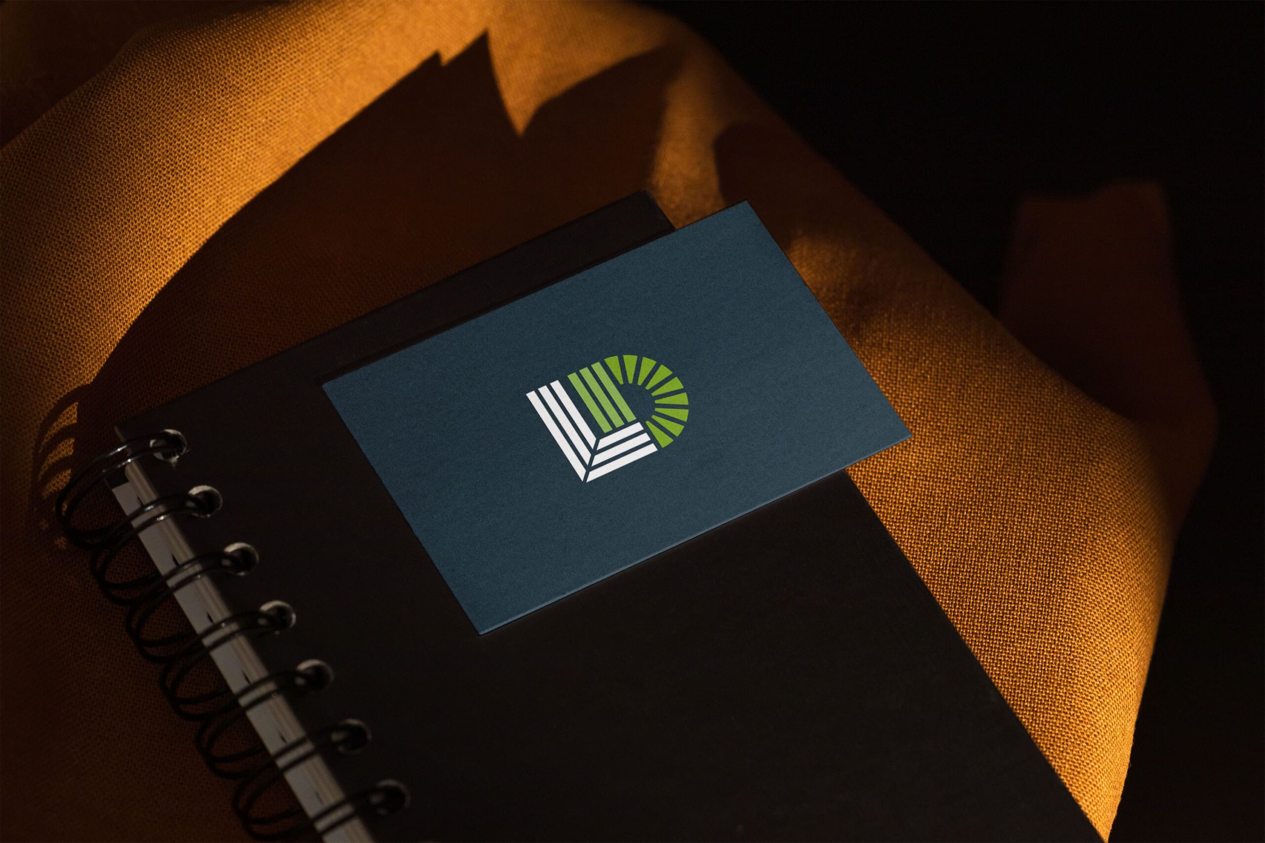 Langley Design icon on a business card on an orange chair