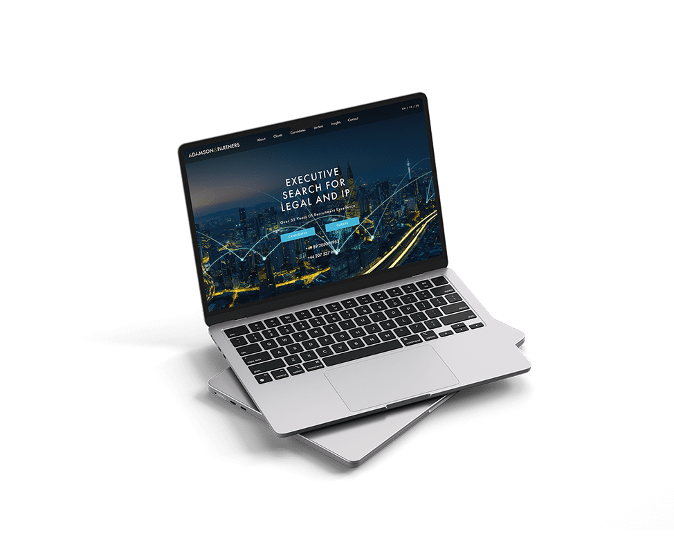 Adamsons and Partners website mockup on a laptop