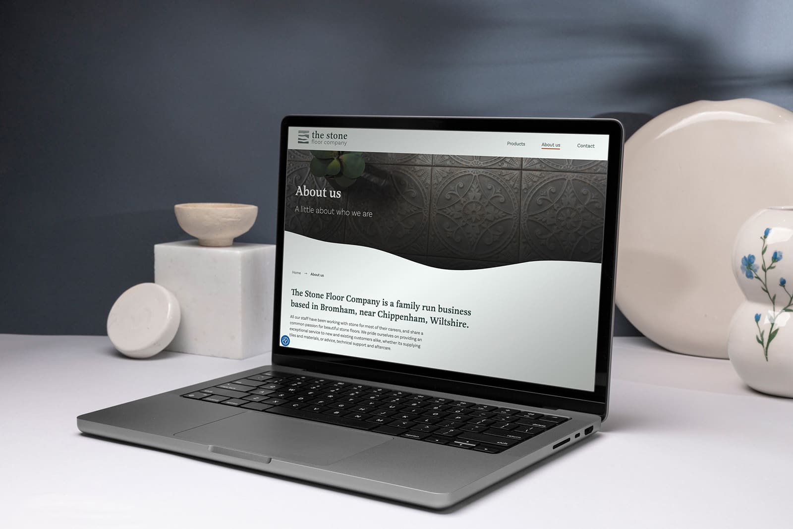 Stone Floor website on laptop