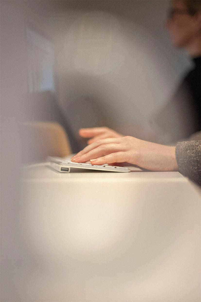 person typing on a keyboard